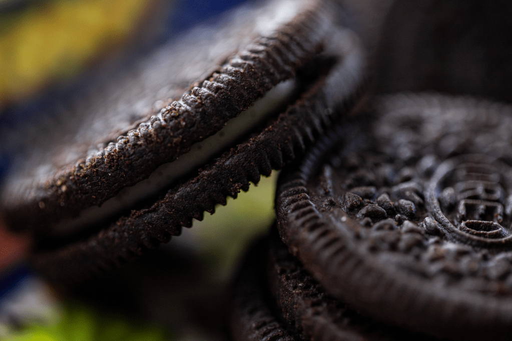 close-up of two Oreo cookies, one leaning against the other. (Photo Tracy Isaacs)