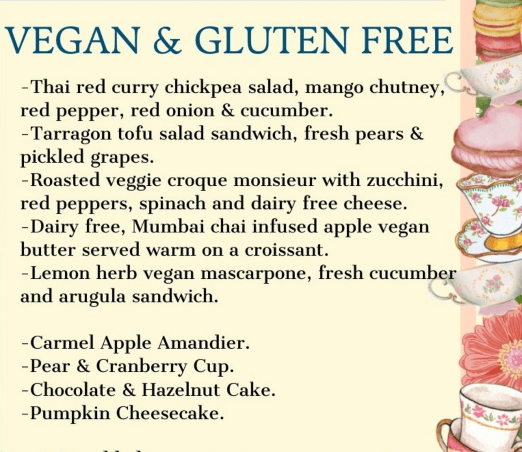 Screenshot of Neverland's Vegan & Gluten Free tea menu with detailed descriptions of four sandwiches (thai red curry chickpea, tarragon tofu salad, roasted veggie croque monsieur, and lemon herb vegan marscapone) and four desserts (carmel apple amandier pear & cranberry cup, chocolate hazelnut cake, pumpkin cheesecake).