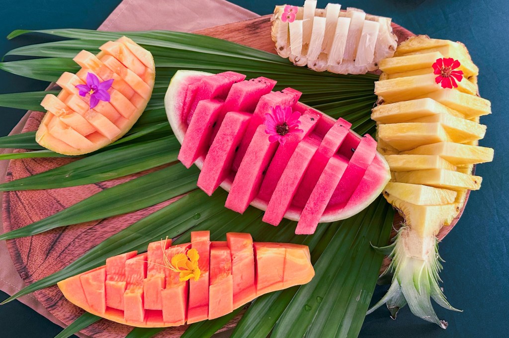 cut fresh tropical fruit. arranged on a palm leaf. Photo by Tracy Isaacs in Costa Rica